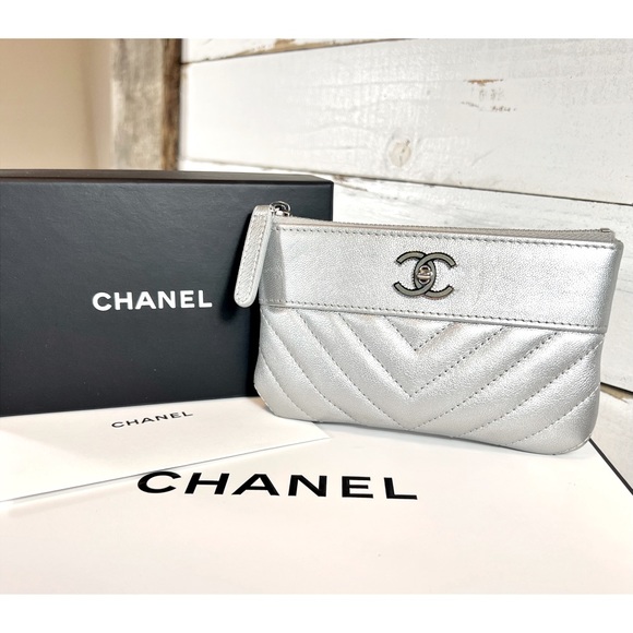 CHANEL Handbags - |SOLD| Chanel Chevron Lambskin Leather CC Logo Pouch